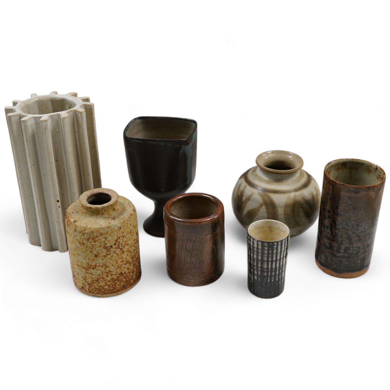 Assorted studio pottery comprising six vases and a goblet, largest 15cm high